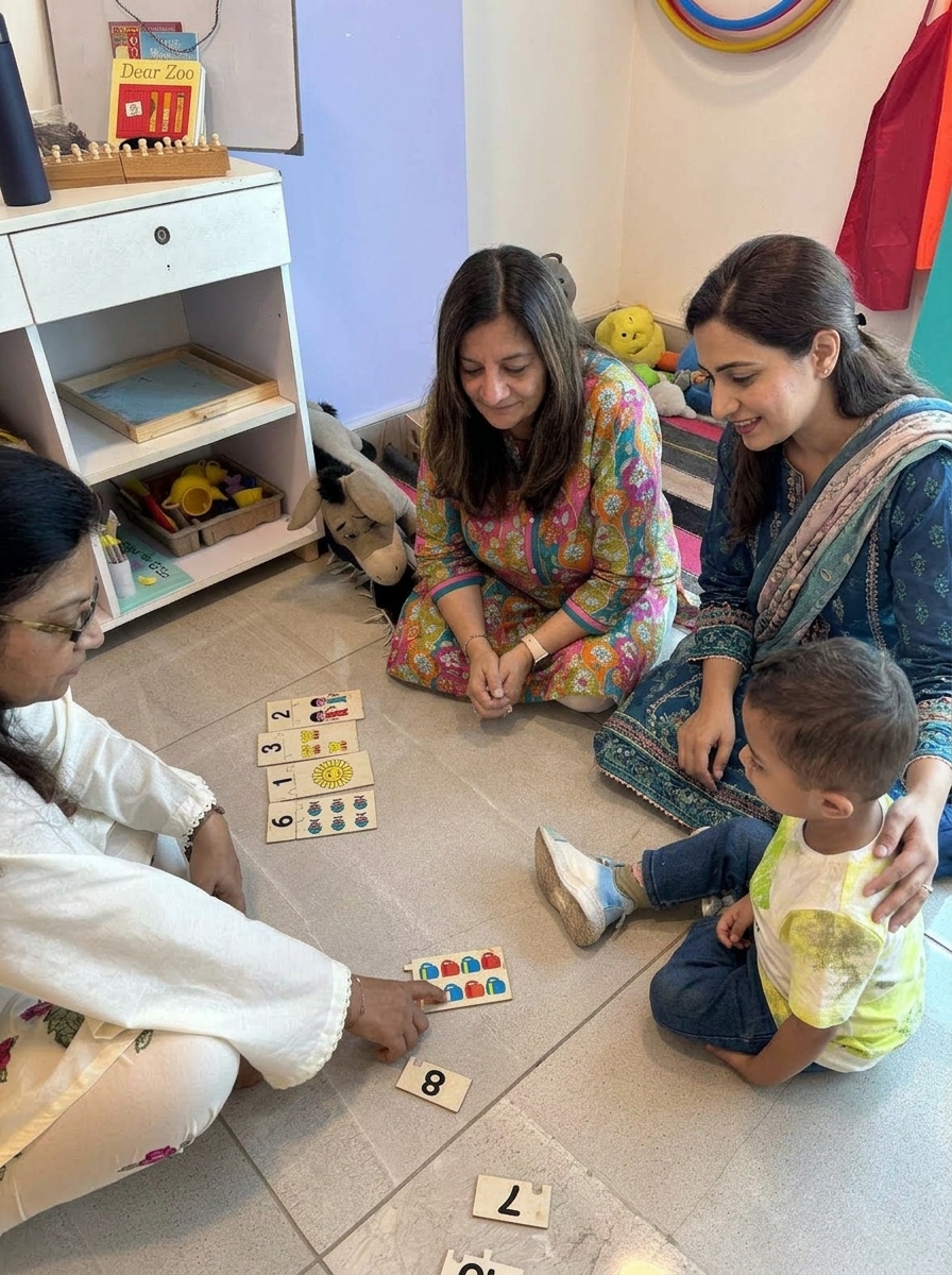 Mother and Learning Lab director Nadya Karamally with therapist supporting child in developmental learning session